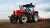Red tractor harrowing