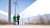 Two engineers at a wind turbine farm