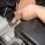 Pour new oil into the engine