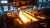 Molten metal pouring in a steel plant, highlighting fire-resistant fluid tips