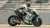 Side view look at fast moving racing motorcycle