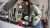Pouring Castrol EDGE motor oil into a hybrid vehicle engine