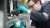 A technician dispenses a viscosity modifier into a beaker to add to a blend at the FPT Technology Center, Pangbourne UK.