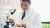 Chemist with microscope