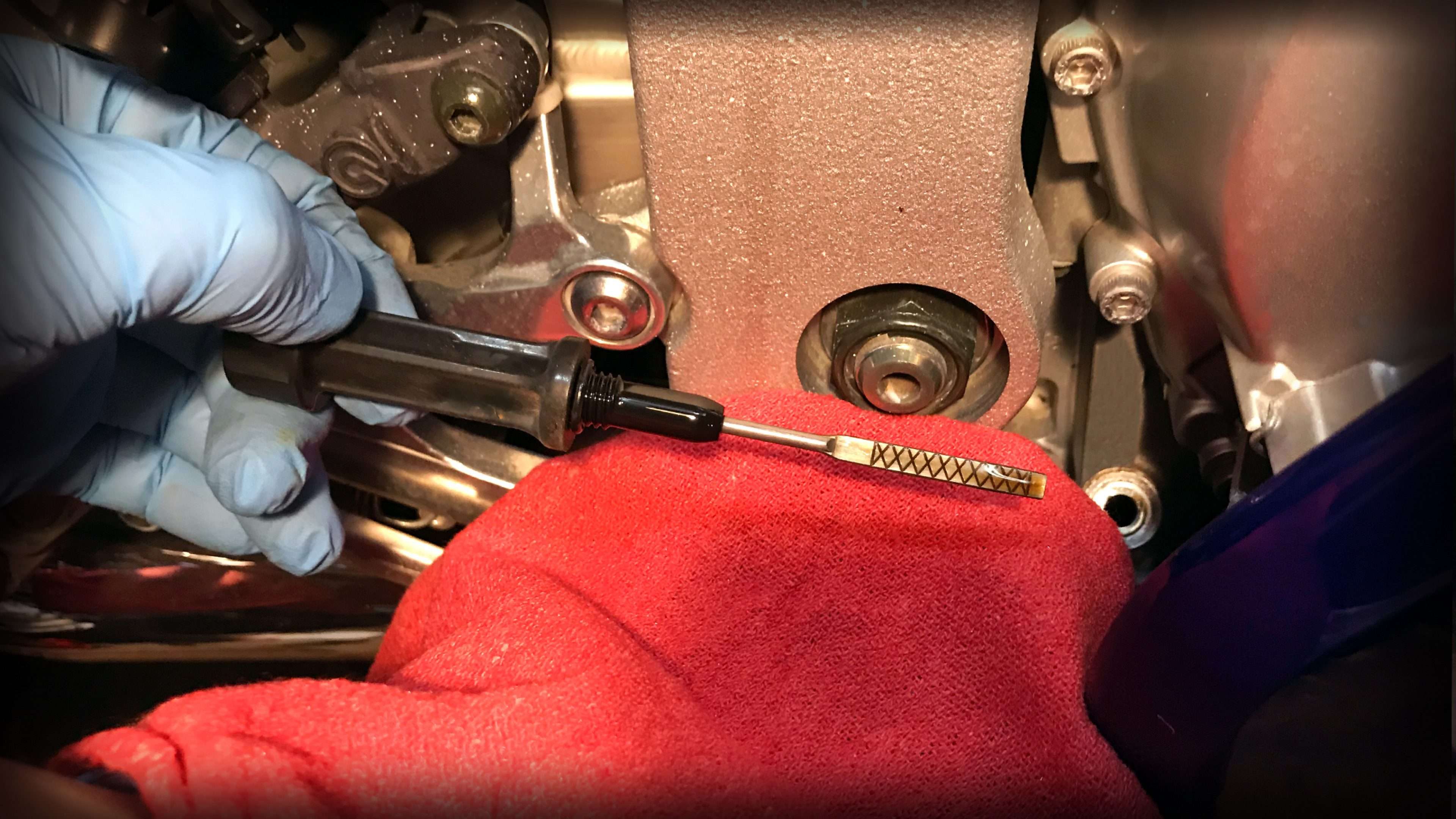 CHECKING OIL THROUGH THE INSPECTION WINDOW MOTORCYCLE OIL & FLUIDS Home