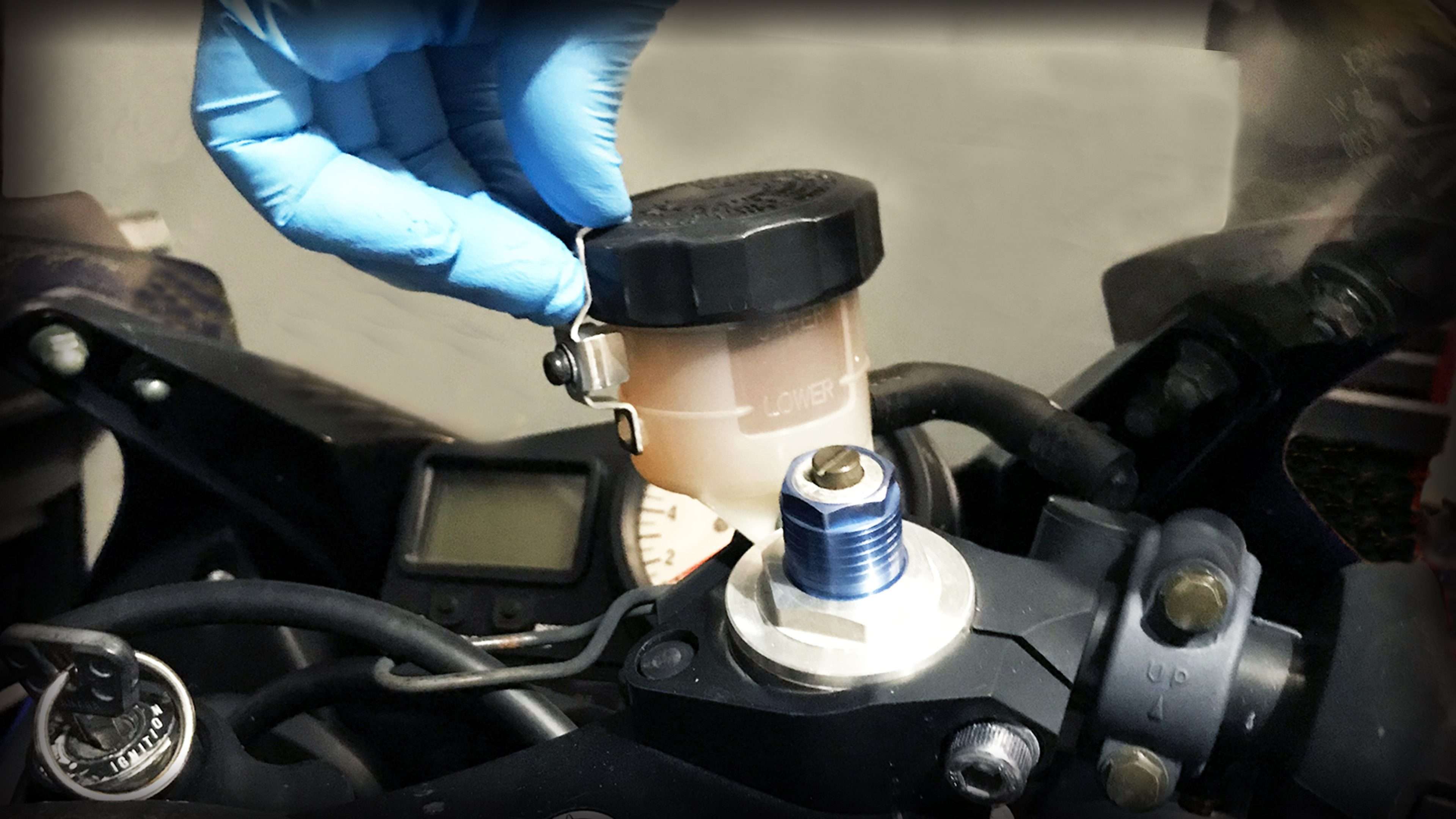 CHECKING MOTORCYCLE OIL WITH A DIPSTICK MOTORCYCLE OIL & FLUIDS Home